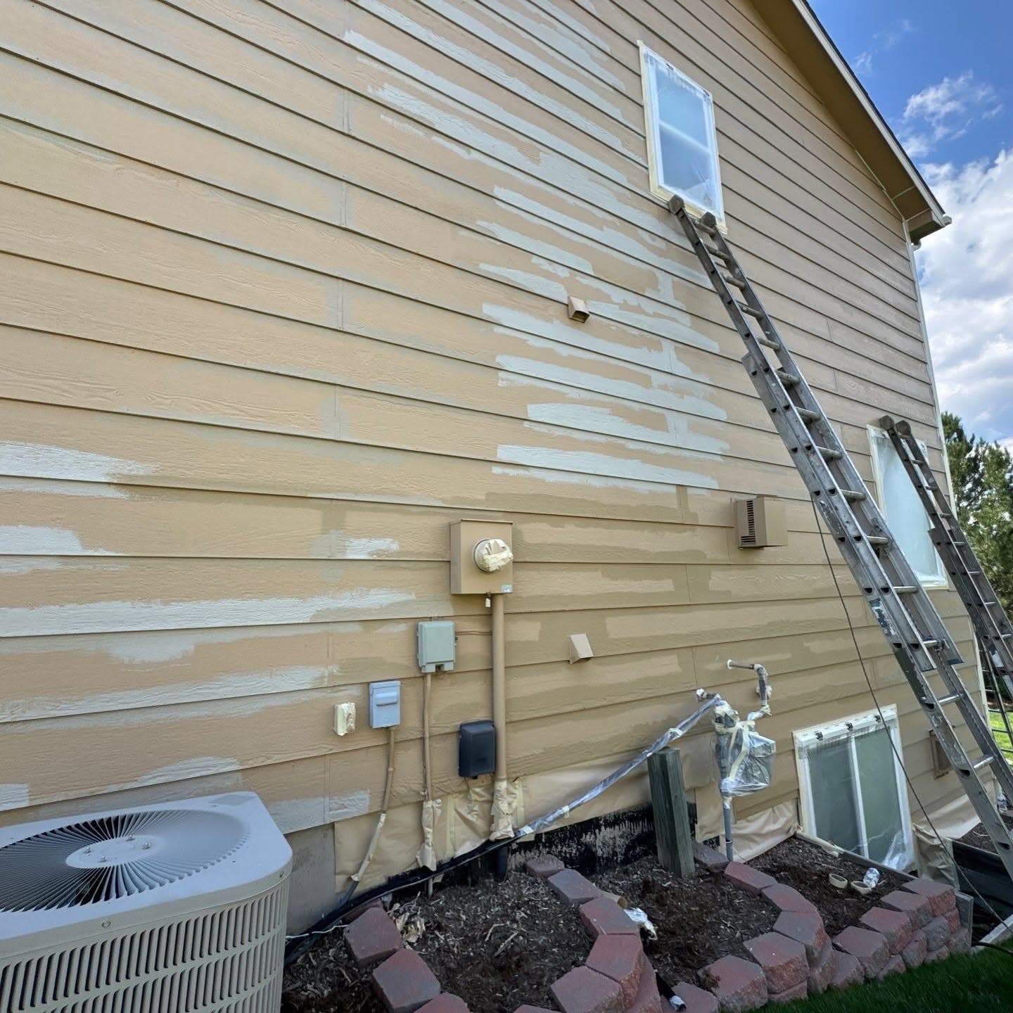 Surface preparation with ladders and protective sheeting