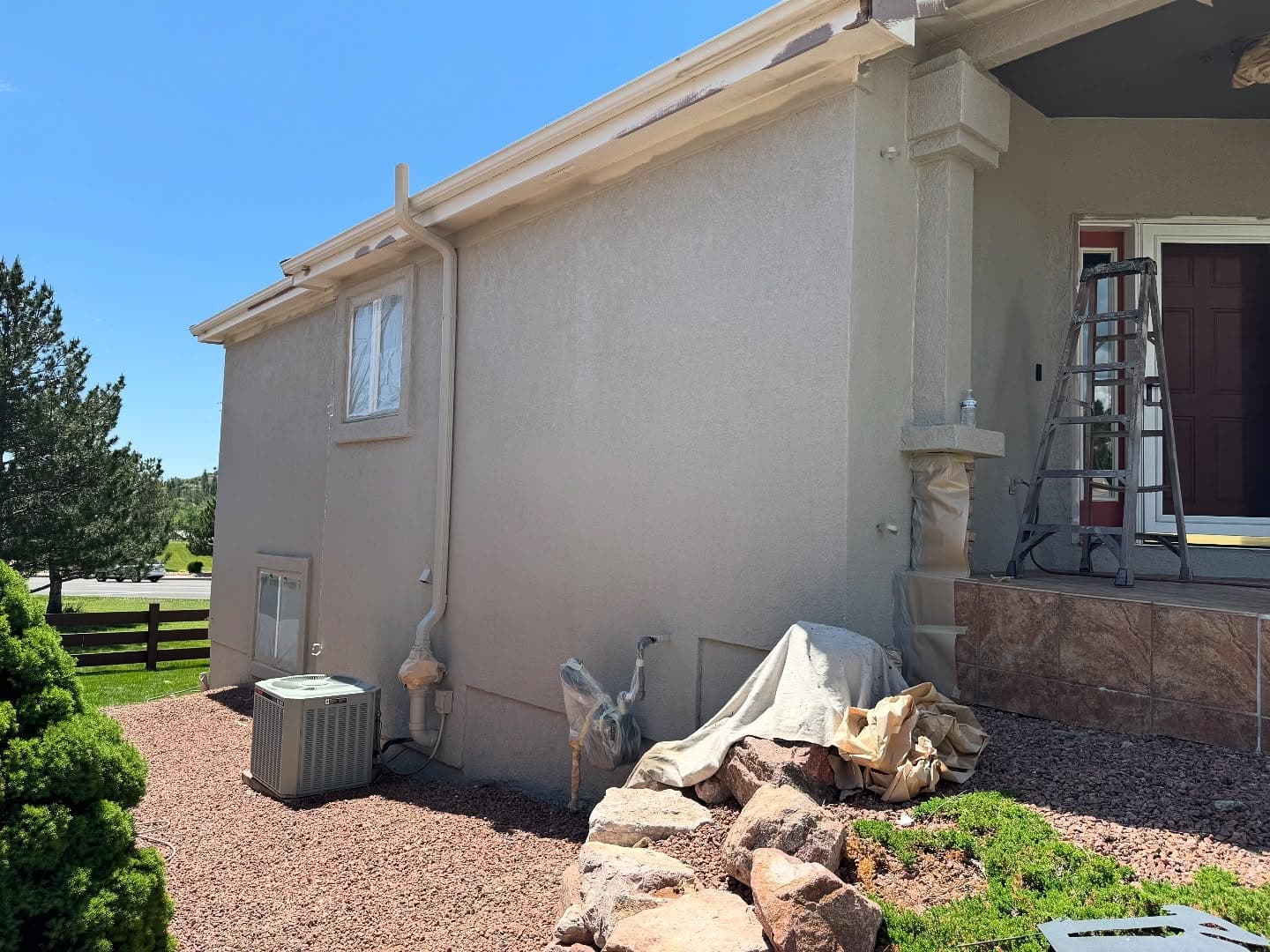 Light-colored stucco siding work